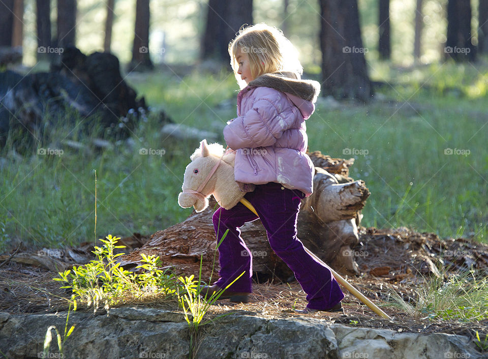 girl the toy horse by arizphotog