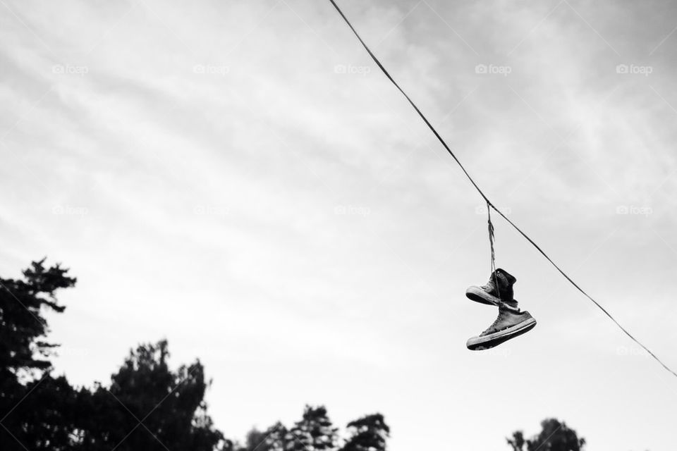 Shoes hanging from a line