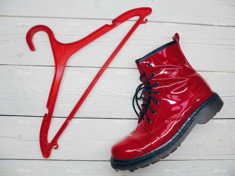 Red women's shoe and cothhanger