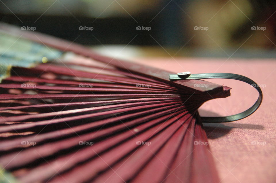 close up hand fan wood