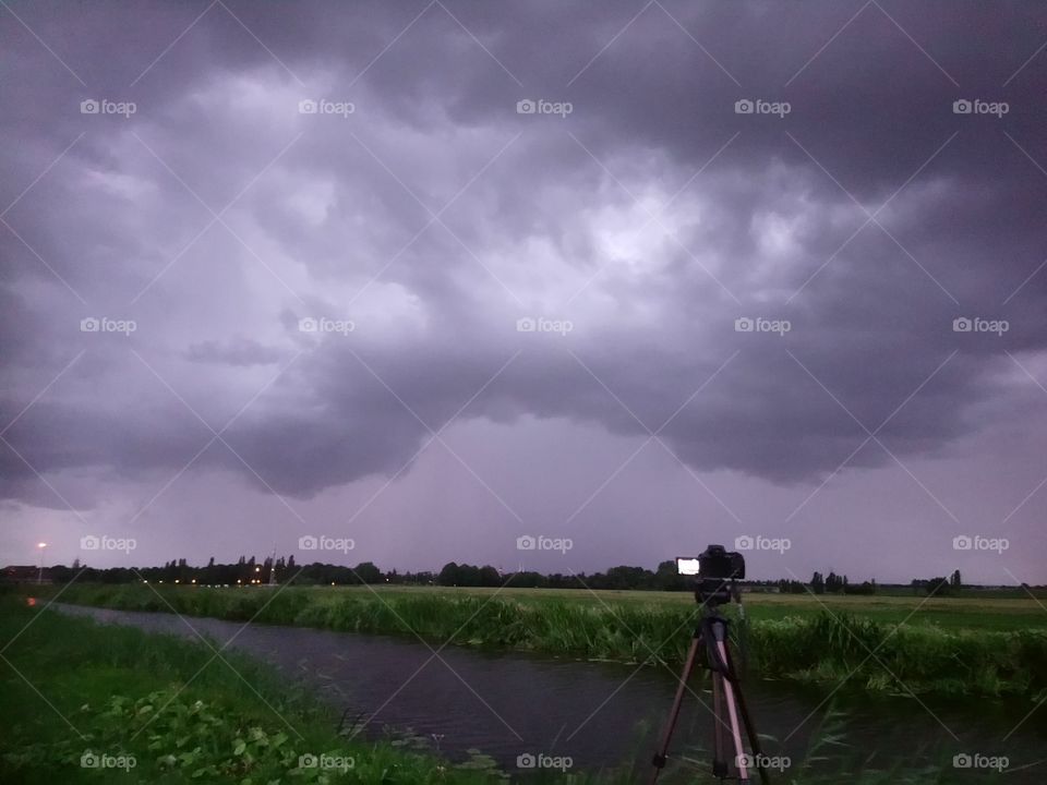 Photographing the Storm. A menacing looking thunderstorm over the dutch countryside near Leiden, Holland.