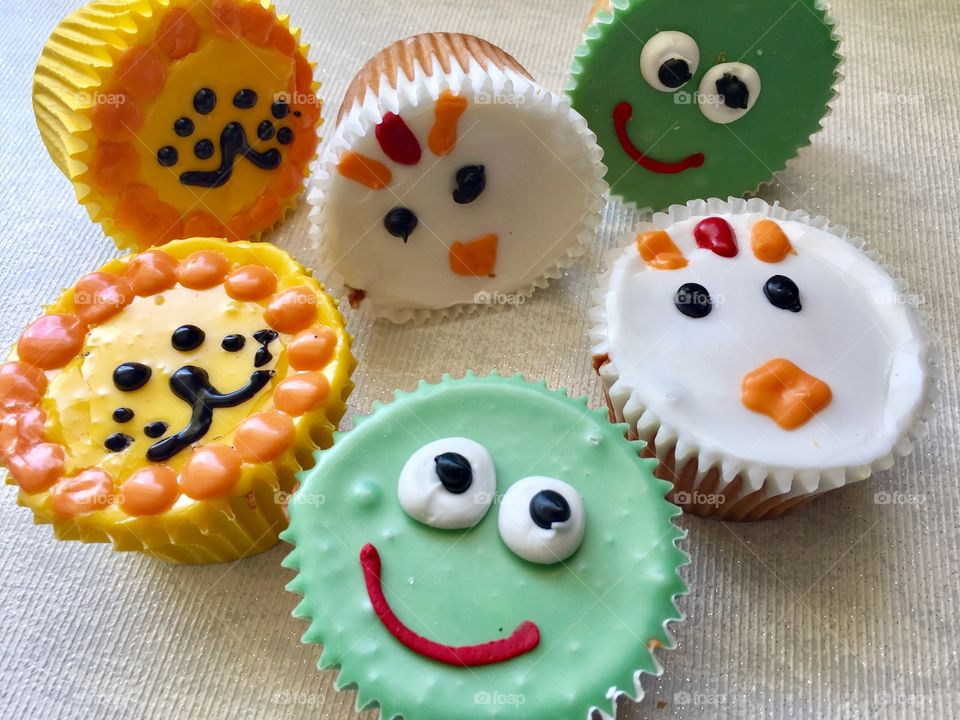 Cupcakes on anthropomorphic faces