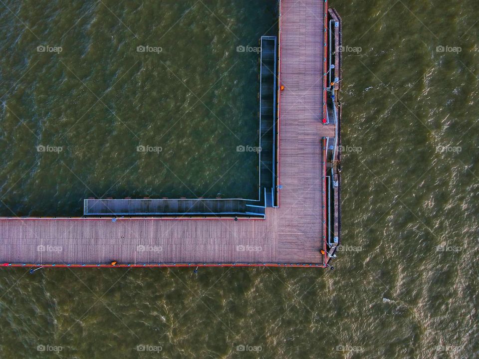 The symmetry of the bridge and sea.
