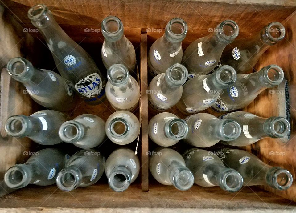 old soda bottles in a crate