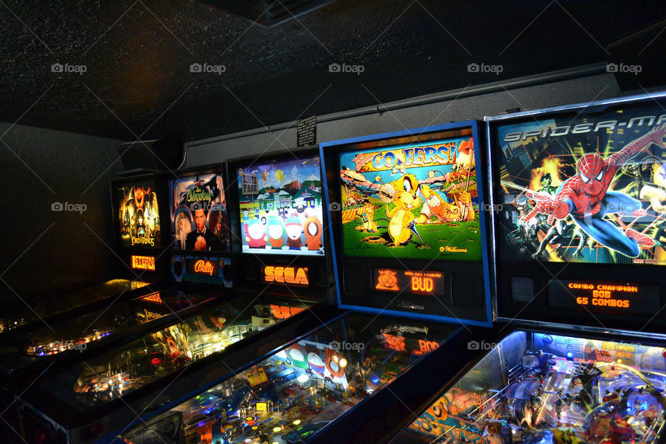 row of pinball machines. A row of pinball machines at the arcade