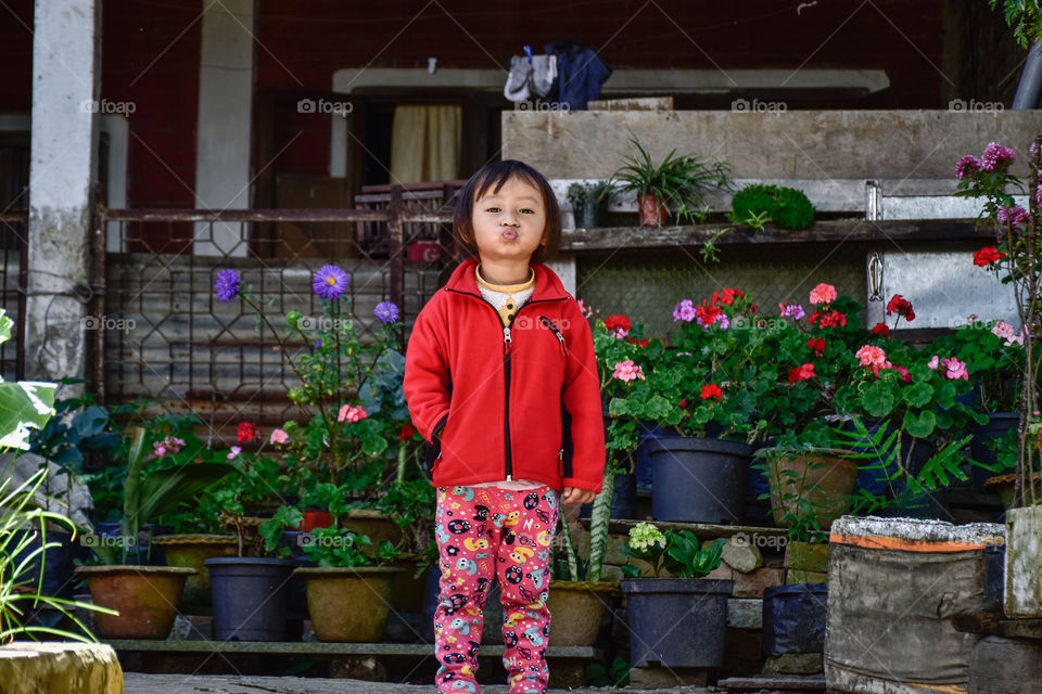 A little girl in red jacket