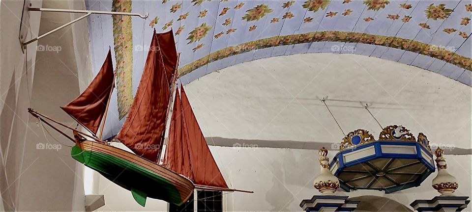 This ship suspended from the vault of the “Inselkirche”, the “Island Church” on the island “Hiddensee”, a former cloister in the town of “Kloster” in “Western Pomerania”, Germany reminds us that seafarers worship here. 2024. Hypnotic Productions
