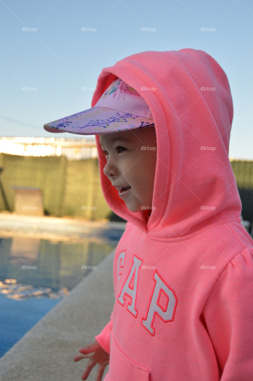 Her cheeks were bright with color and her eyes shone and her mouth turned up in its small childlike smile