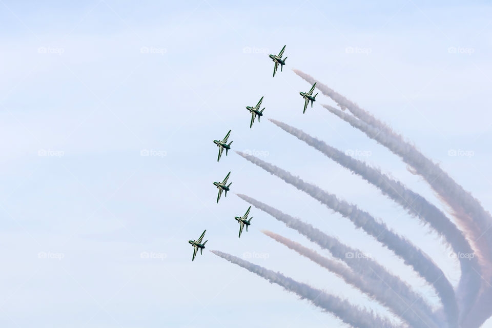 An aerobatic team performing their tricks in the sky