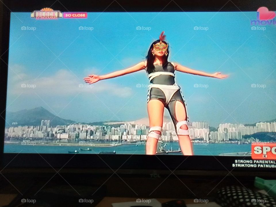 A SCENE FROM THE MOVIE,  "SO CLOSE",   WHERE ONE OF THE CHARACTER,  JUMP OFF BACKWARDS FROM A BUILDING,