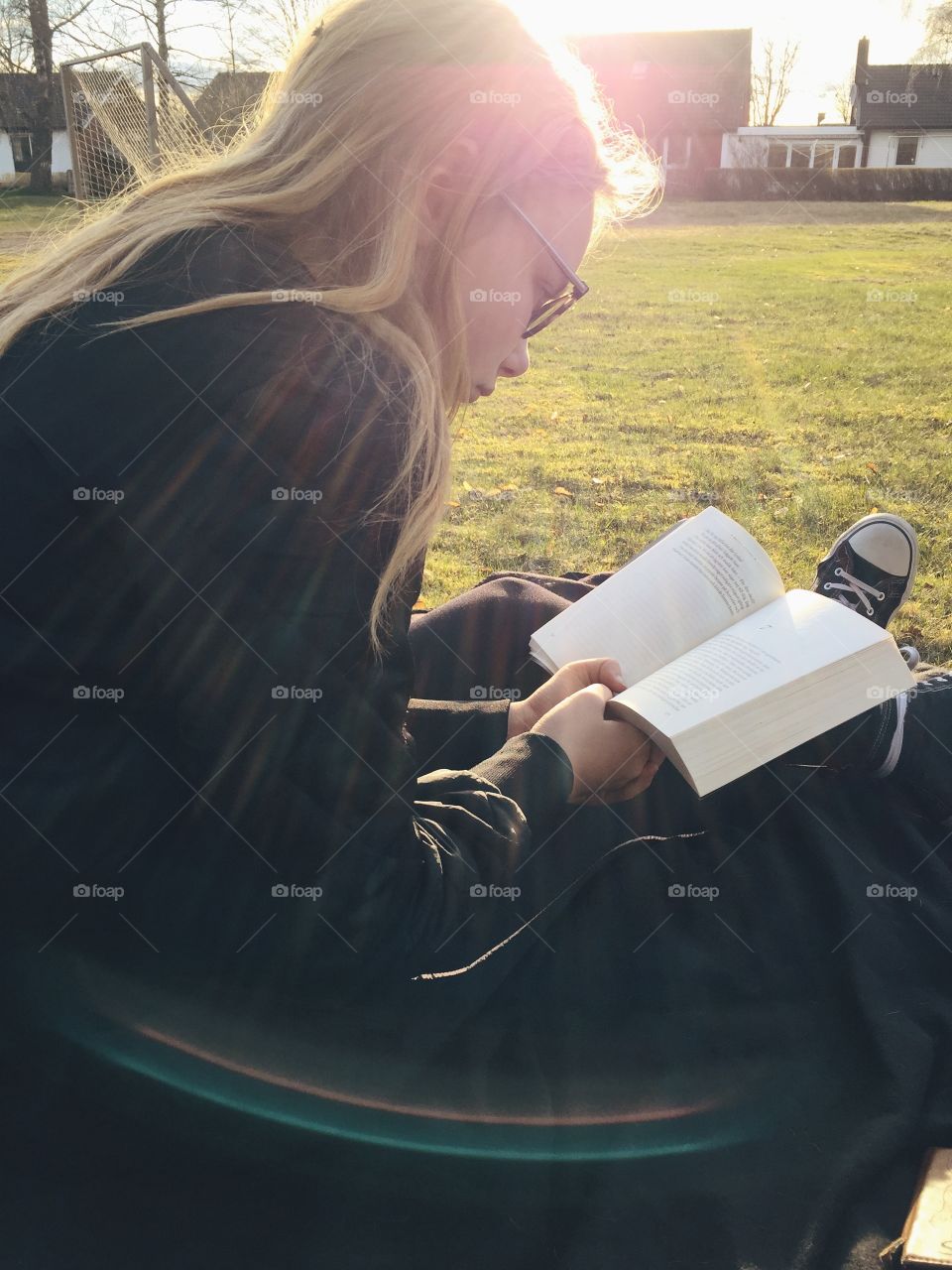 Teenage girl reading novel