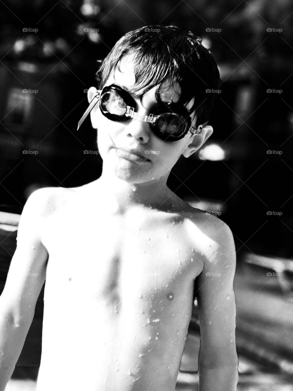 My son posing while swimming this summer