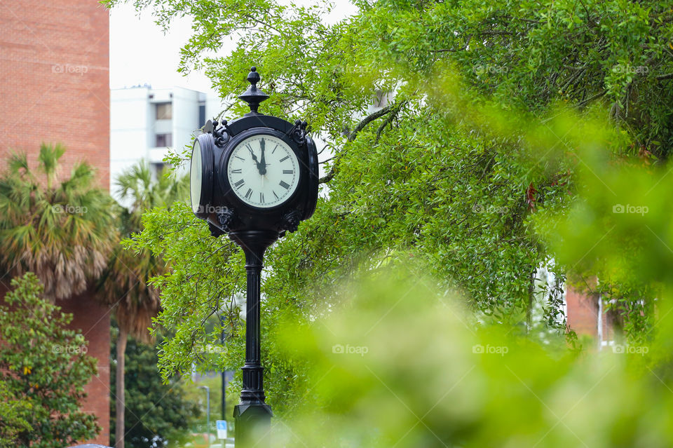 A clock at downtown Miami showing 11am on a beautiful Spring day in Florida. 