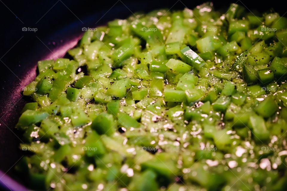 Green Peppers Cooking In A Frying Pan 