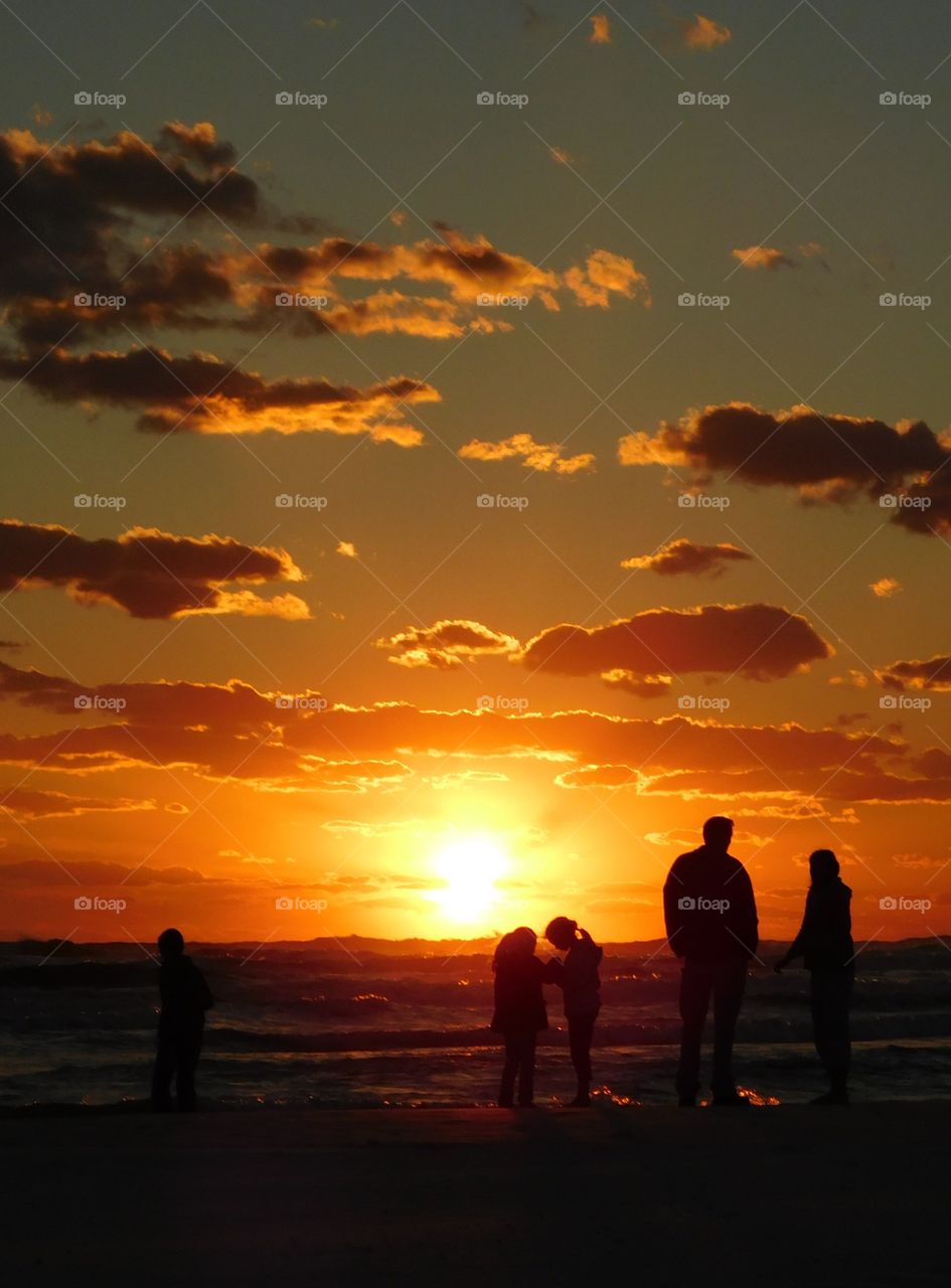 Silhouette of family at beach