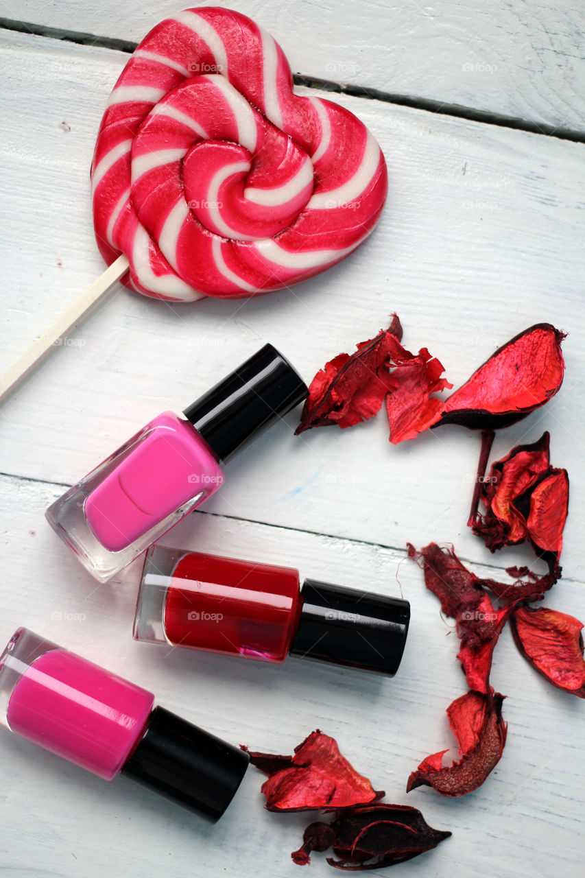 Beauty, health, spa and personal care: nail polish, flowers, rose petals, sweet