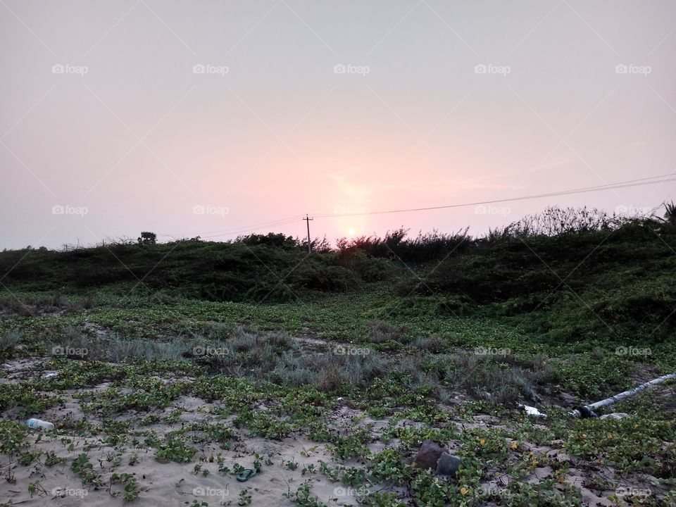 a sunset near a beach