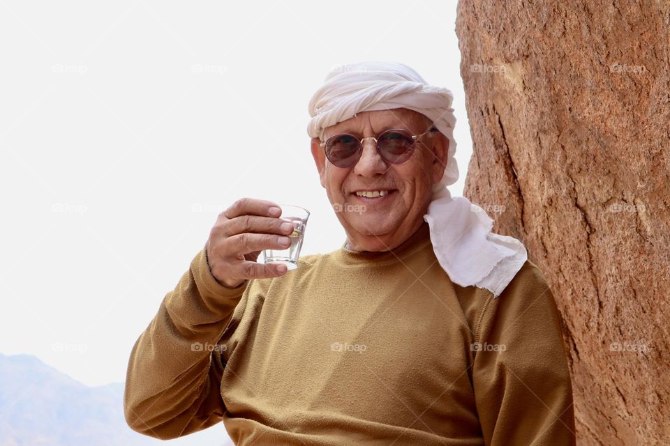 Happy man with cup of herb tea