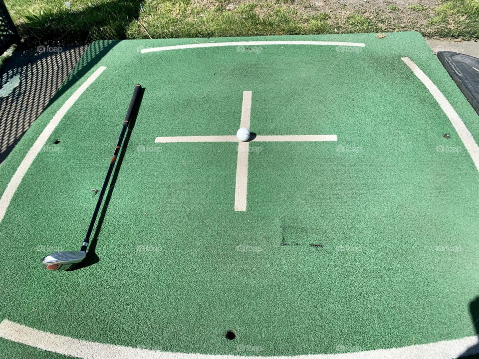 Green and white grass and turf At the golfing range 