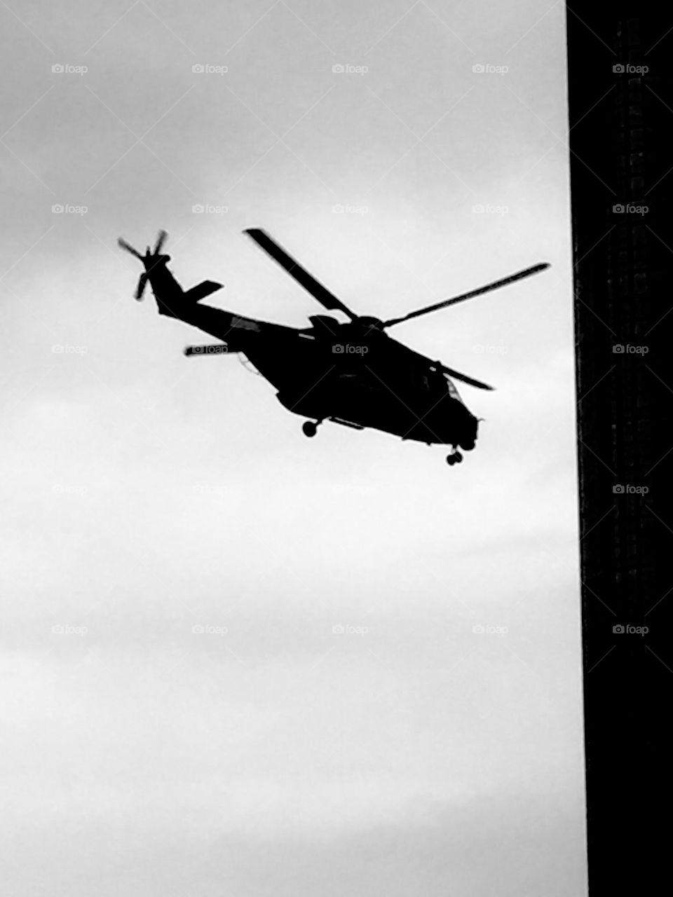 Helicopter coming into land silhouette 