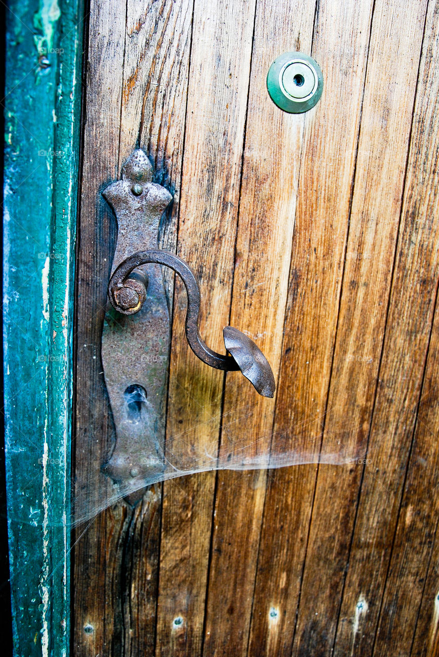 Old door handle with cobweb