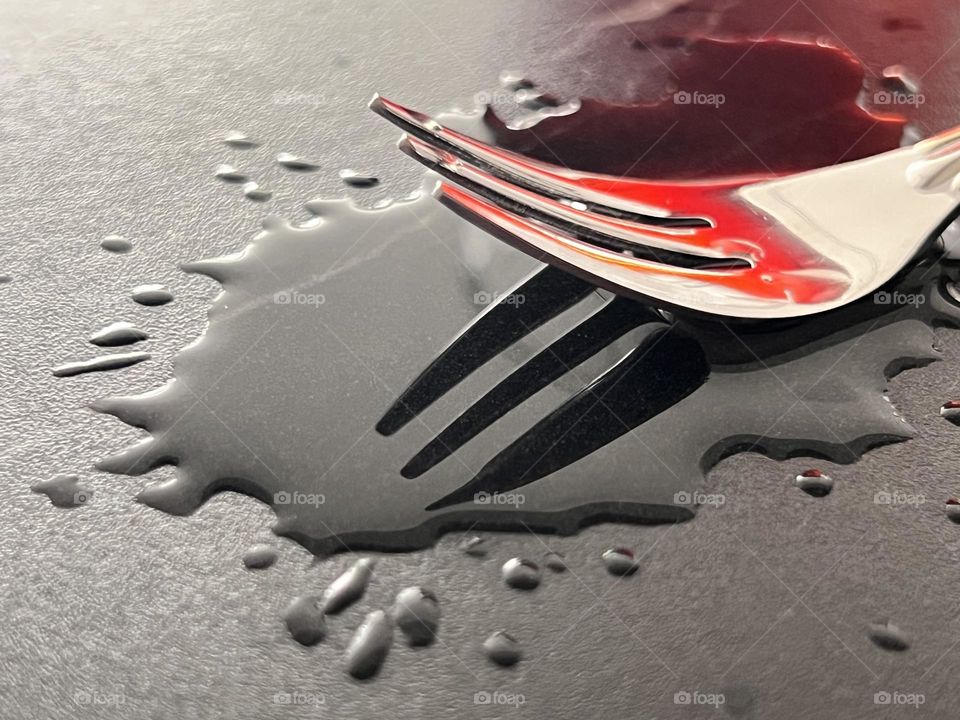 Spilled liquid and fork