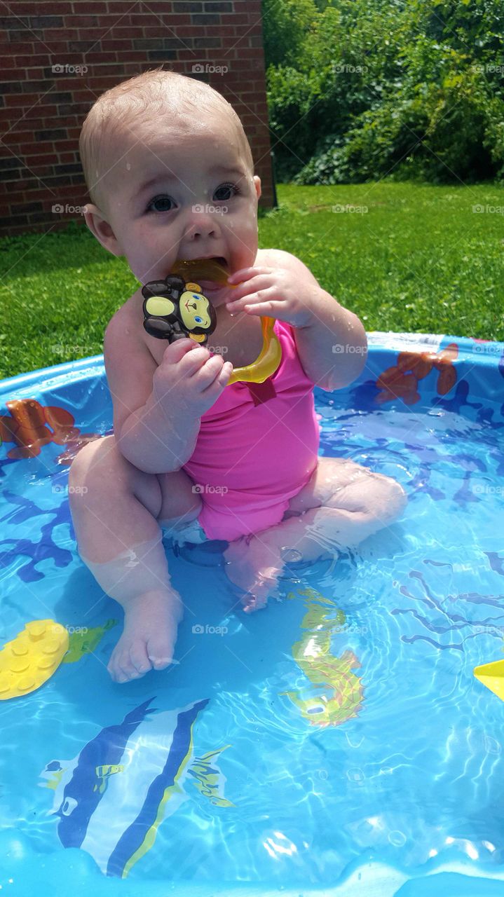 baby teething in swimming pool