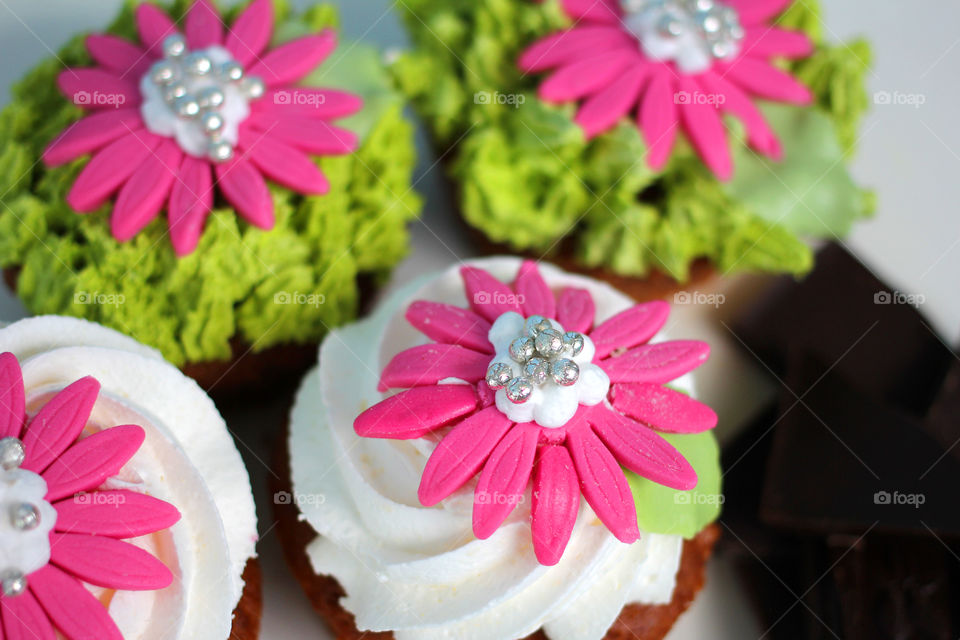 Crazy cupcakes, muffins, a cupcake, a bright cupcake, a cupcake with cream, Cake, sweetness, dessert, cream, bright cake, sugar, delicious cake, flower, cake with flower, color, Fruitcake