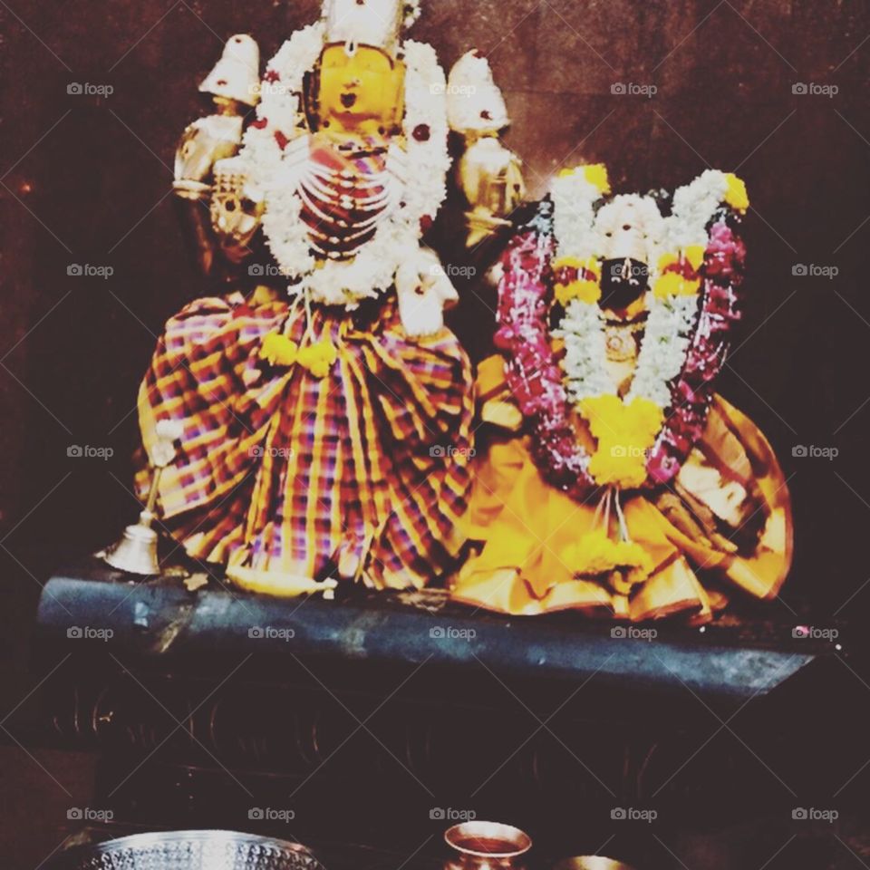 Statues of Hindu Godesses decorated with garlands 