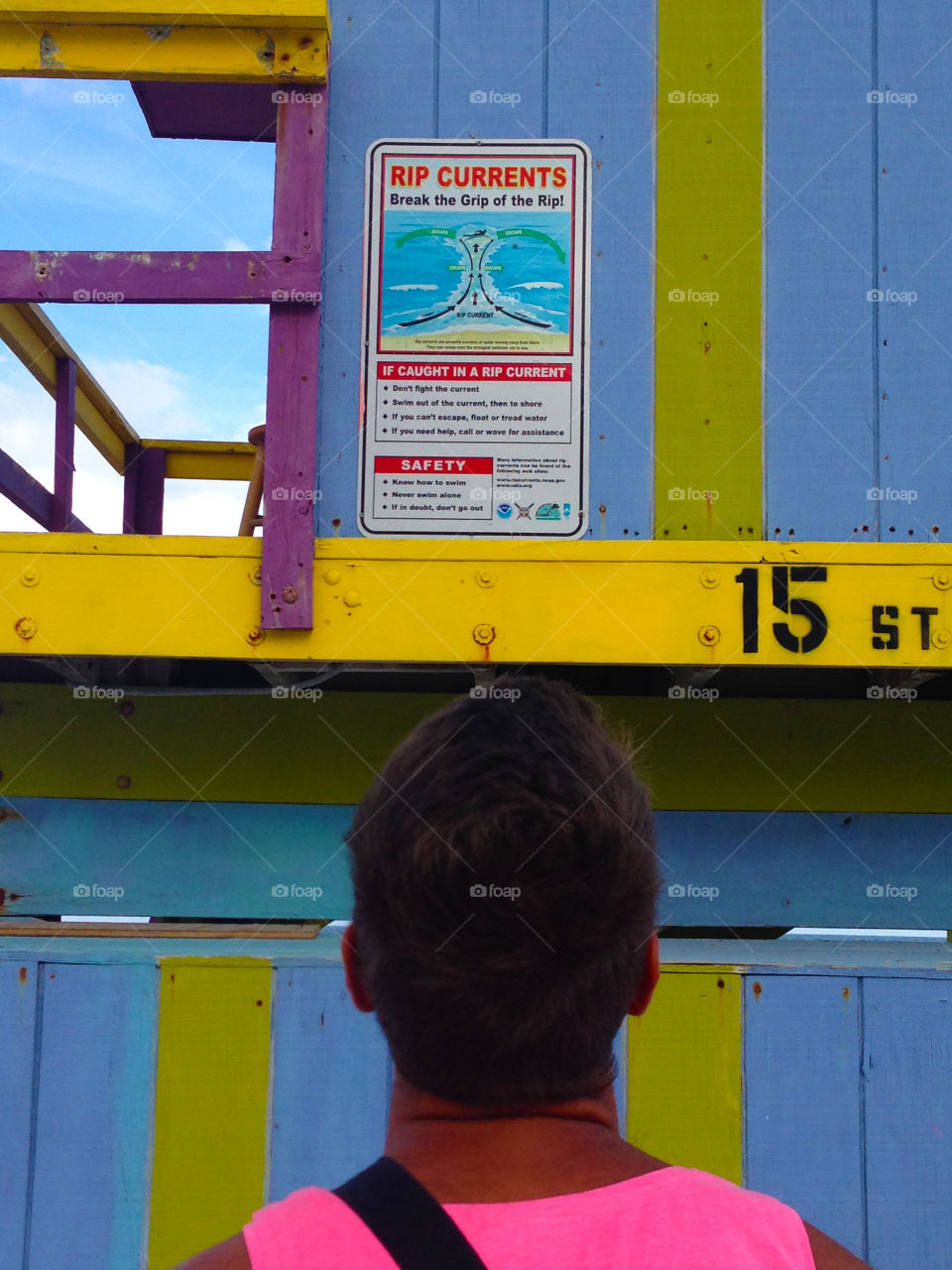 the head of a man looking at the lifeguard tower in Miami Beach