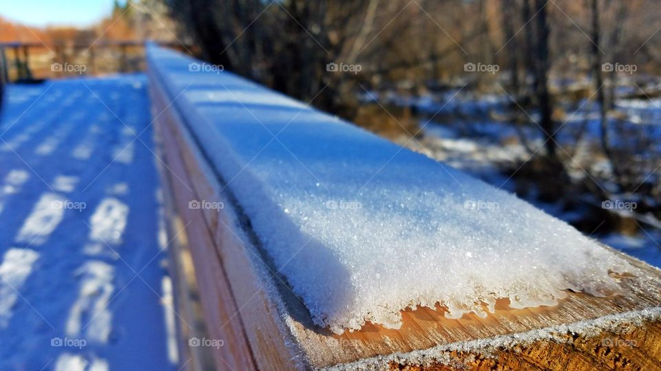 Snow on the wooden rails