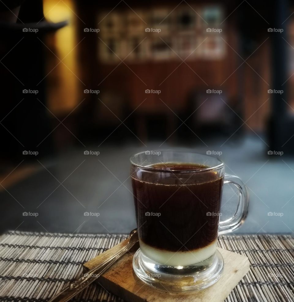 Espresso + milk in a coffee shop with a traditional concept