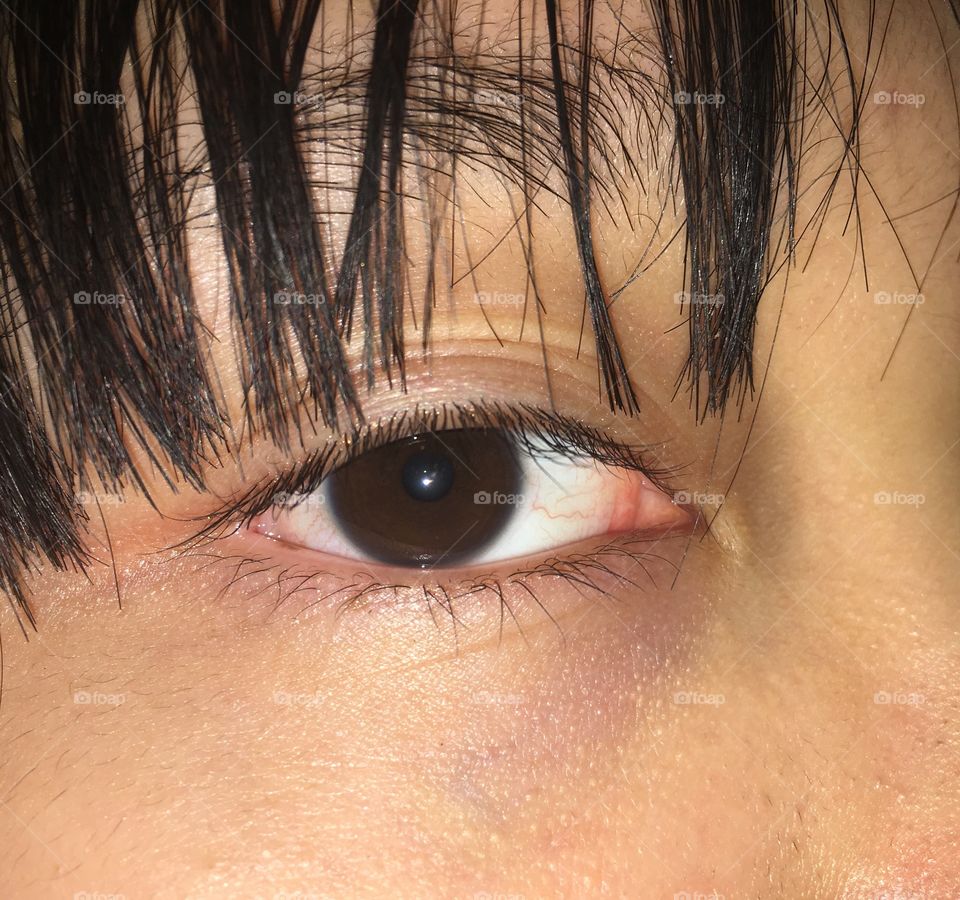 very CLOSE-UP shot of an example of asian (Filipino) eyes! along with roughly cut bangs for extra 😂