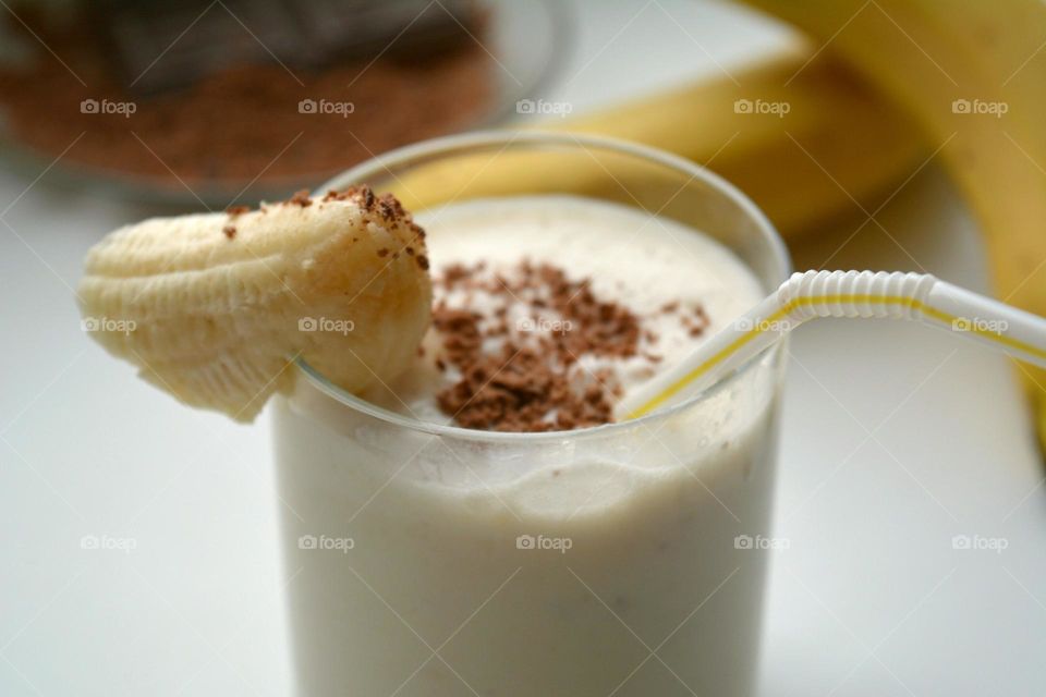 Close-up of banana and milk cocktail