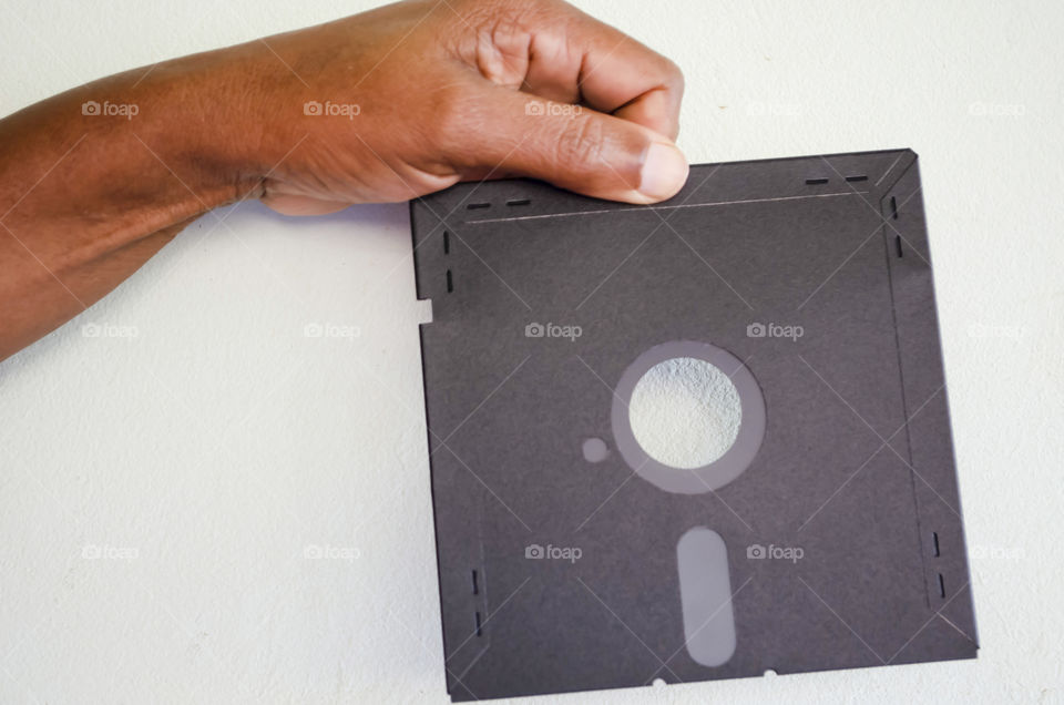 Holding Floppy Data Storage Disc