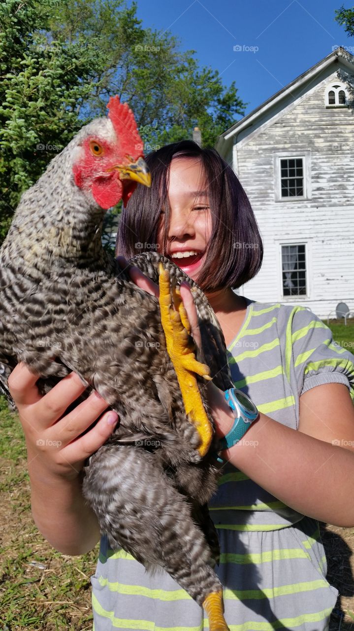 a girl and her bird?. unusual playmates