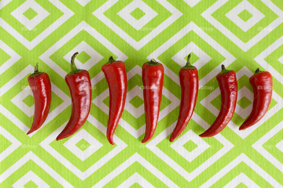 Peppers on a Green Background 