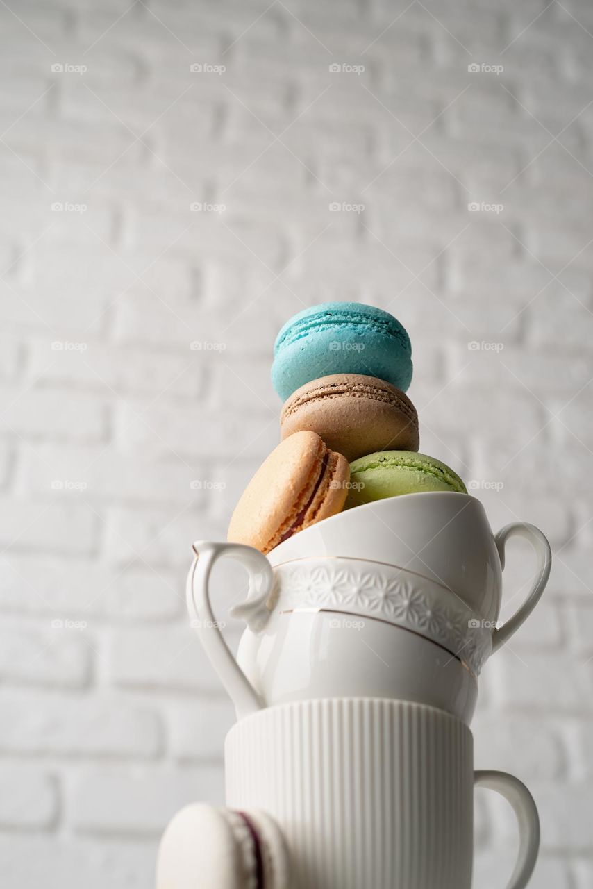 white cups with macarons