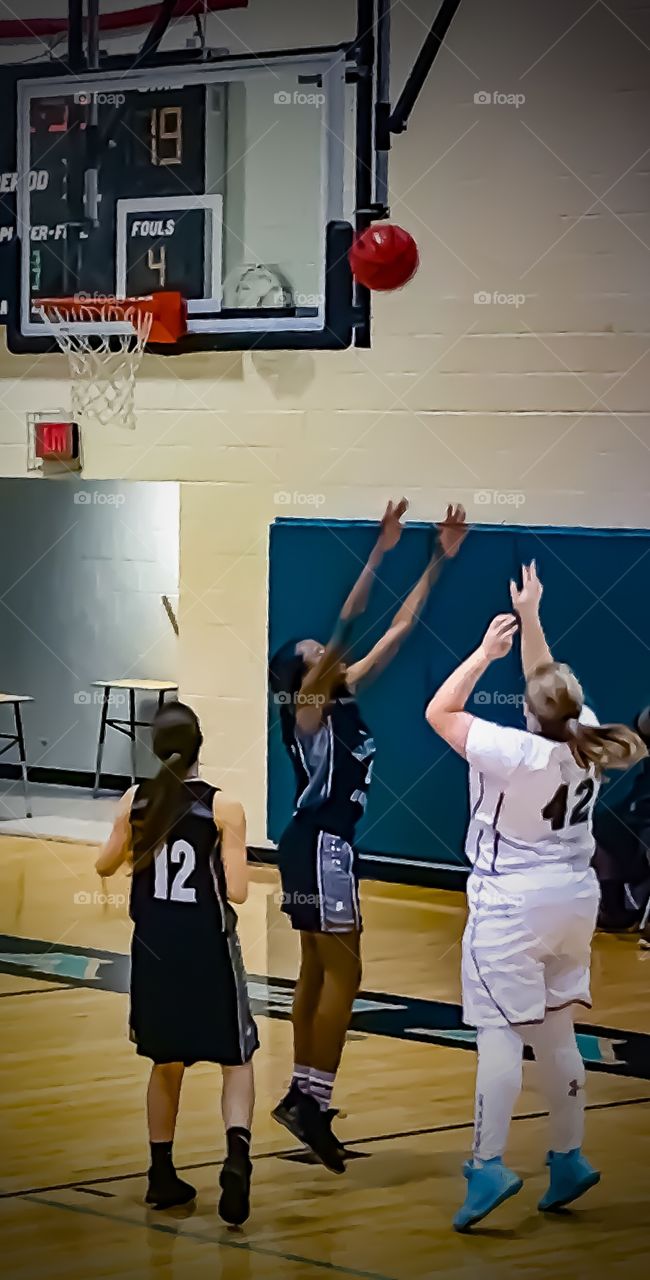 My sister playing on her high school basketball team. 
