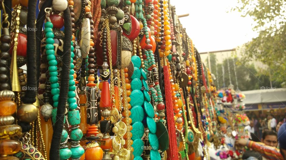Roadside vendors showing their arts by hanging mala's