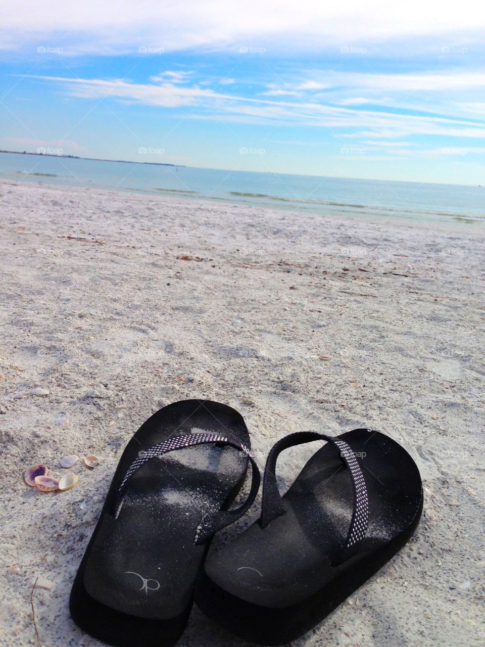 Flip flops on a beach