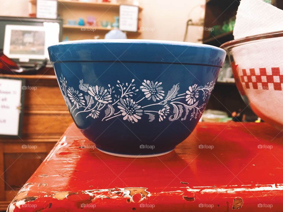 Blue bowl on a red table 