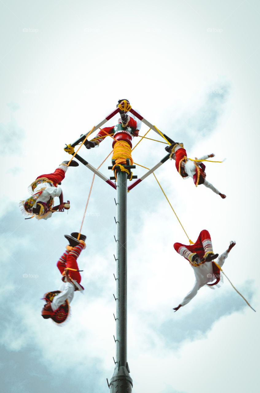 Papantla flying men in Mexico it's an ancient Mesoamerican ritual dance