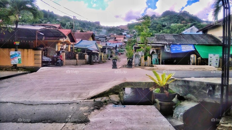at noon in a suburban village, under a not-so-high mountain