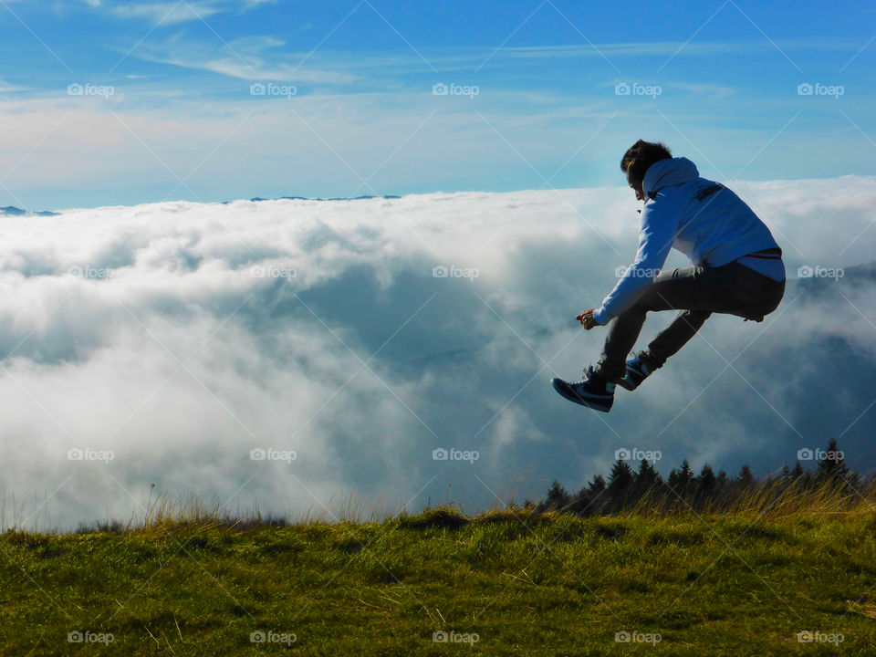 A jumper over the clouds