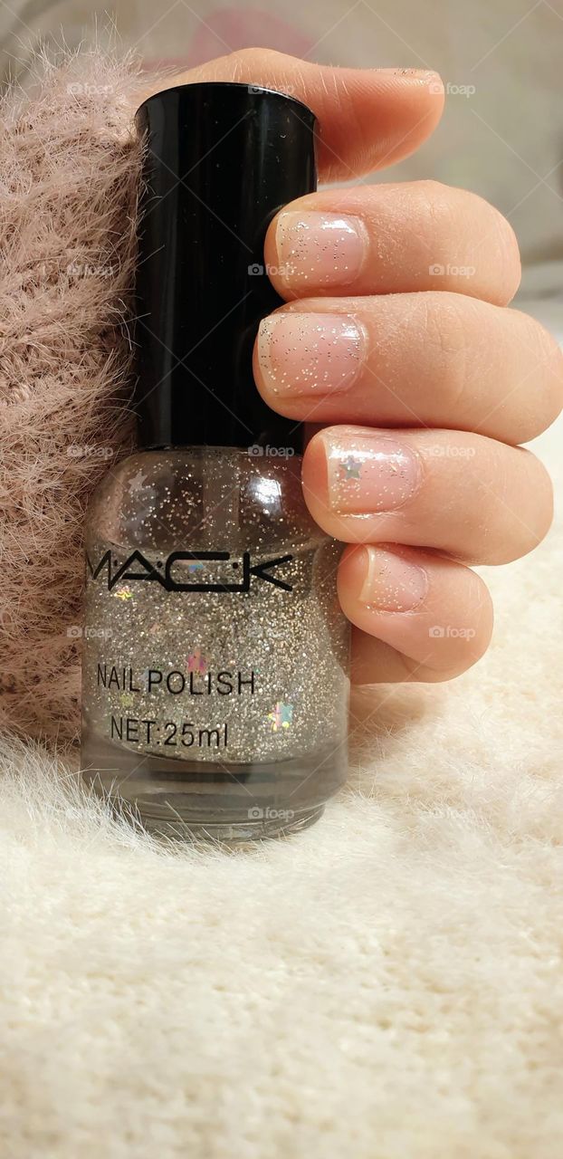 maintenance of your nails, with special care, with a beautiful shine that enhances the beauty of your hands.  frosty glitter nail polish.  Marca Mack