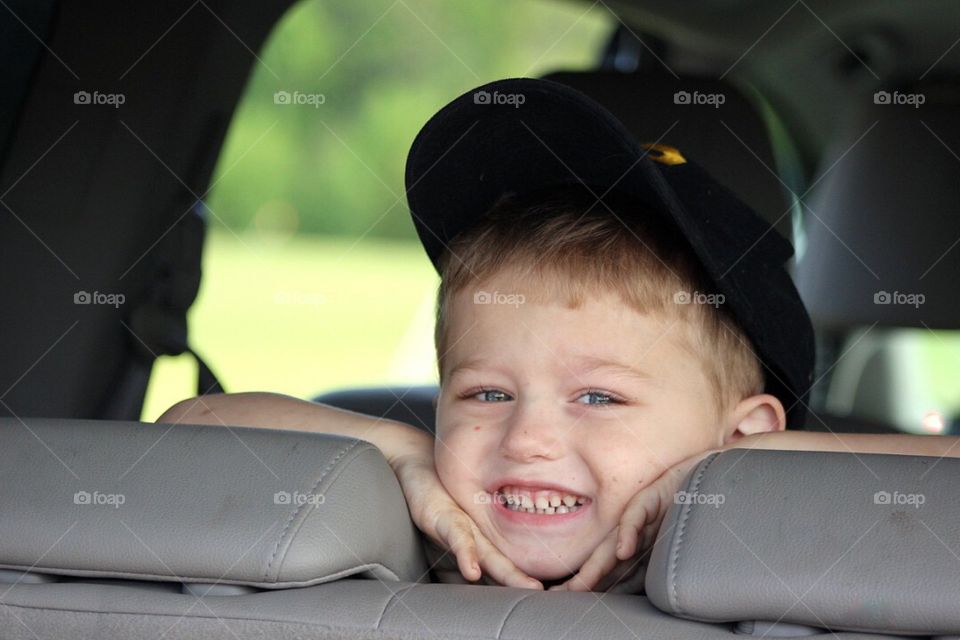 Smiling boy in car
