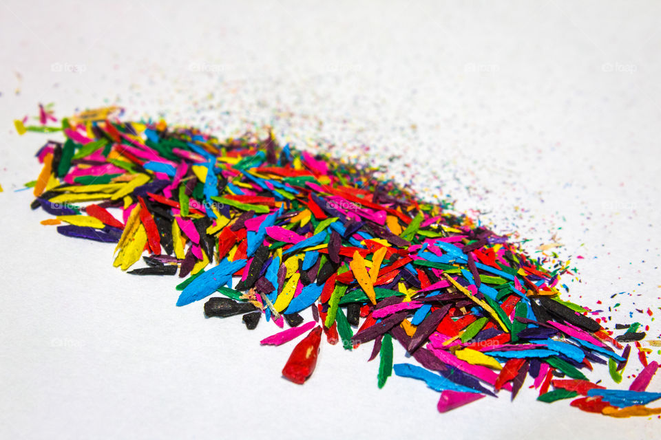 Abstract shot of the colorful crayon tips with a white background.
