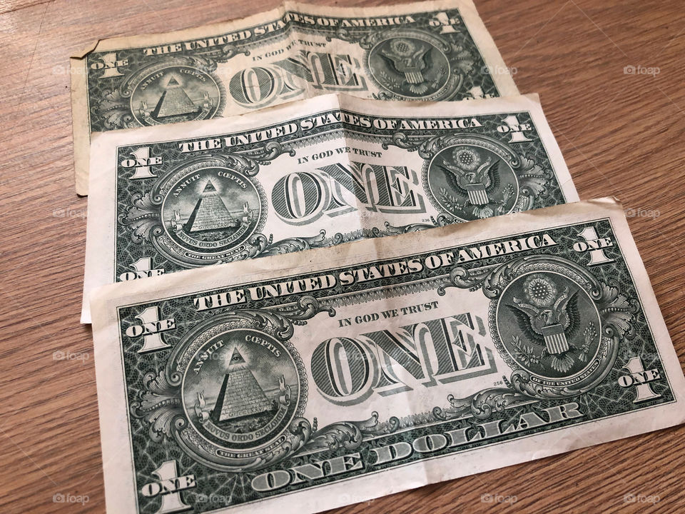 dollars on wooden background