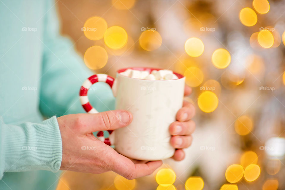 cup of coffee in a cozy festive Christmas atmosphere